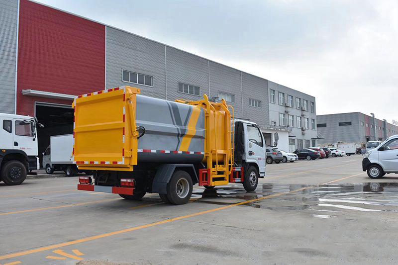 東風(fēng)多利卡D6藍(lán)牌7方側(cè)裝壓縮垃圾車