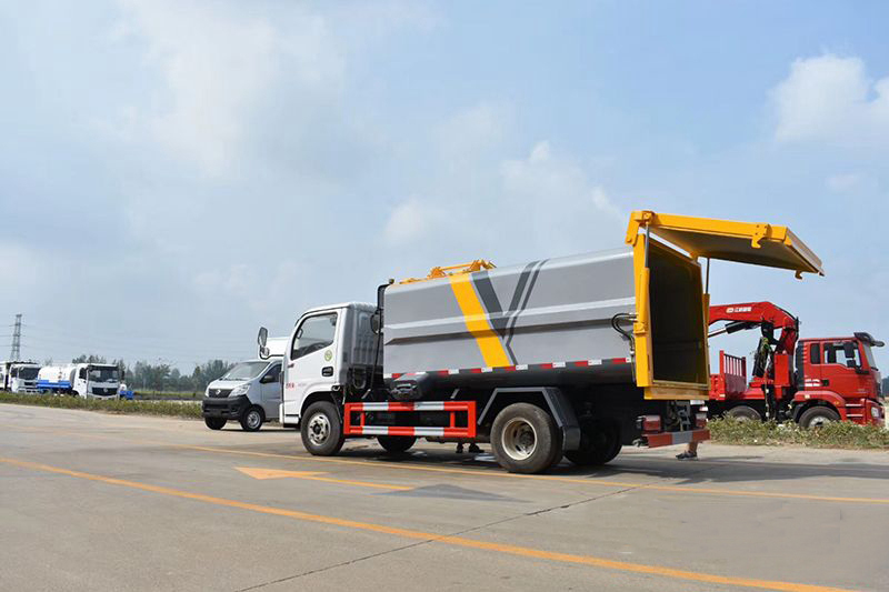 東風(fēng)多利卡D6藍(lán)牌7方側(cè)裝壓縮垃圾車